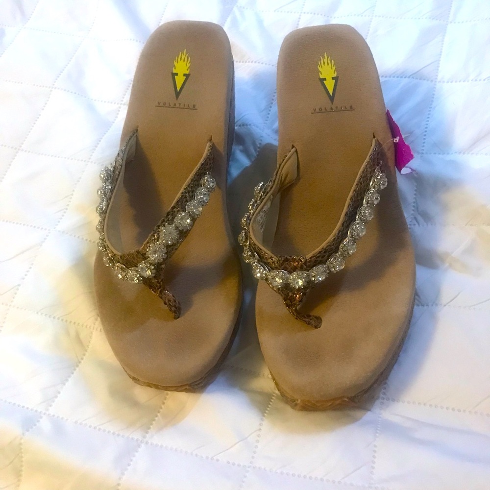 Volatile wedge shoes with diamond detail.